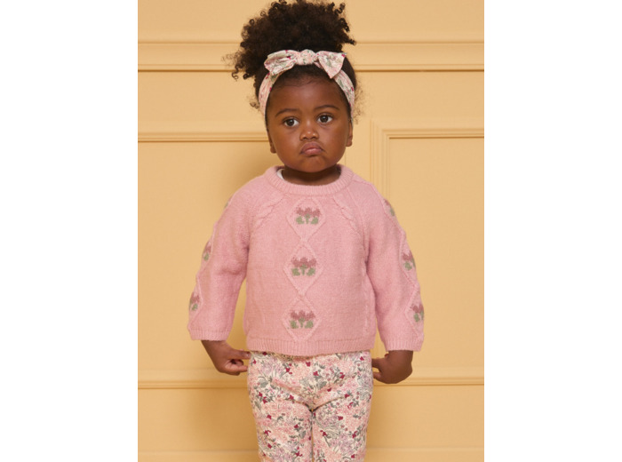 Pull torsadé rose pâle fleurs